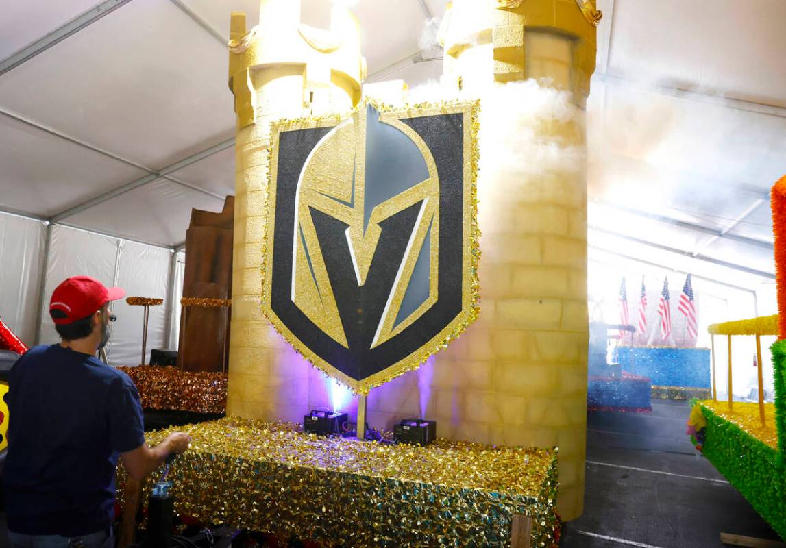 Dave Bailey, a volunteer, tests the fog machine on the “Vegas Golden Knights” flo ...