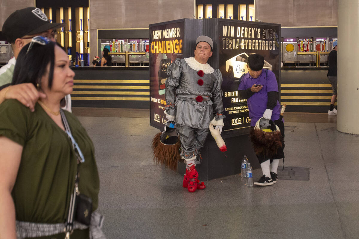 A couple of buskers take a break at the Fremont Street Experience Monday, July 1, 2024, in Las ...