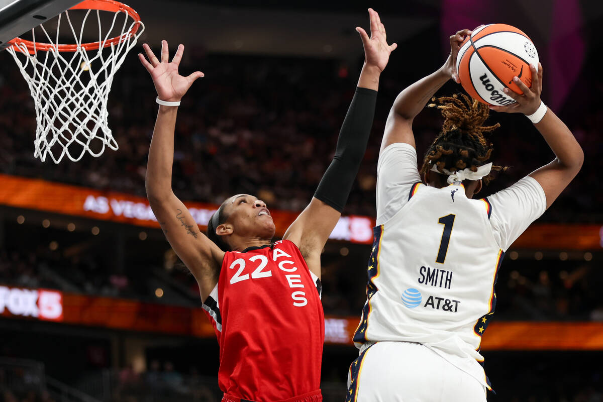 Las Vegas Aces center A'ja Wilson (22) defends while Indiana Fever forward NaLyssa Smith (1) sh ...