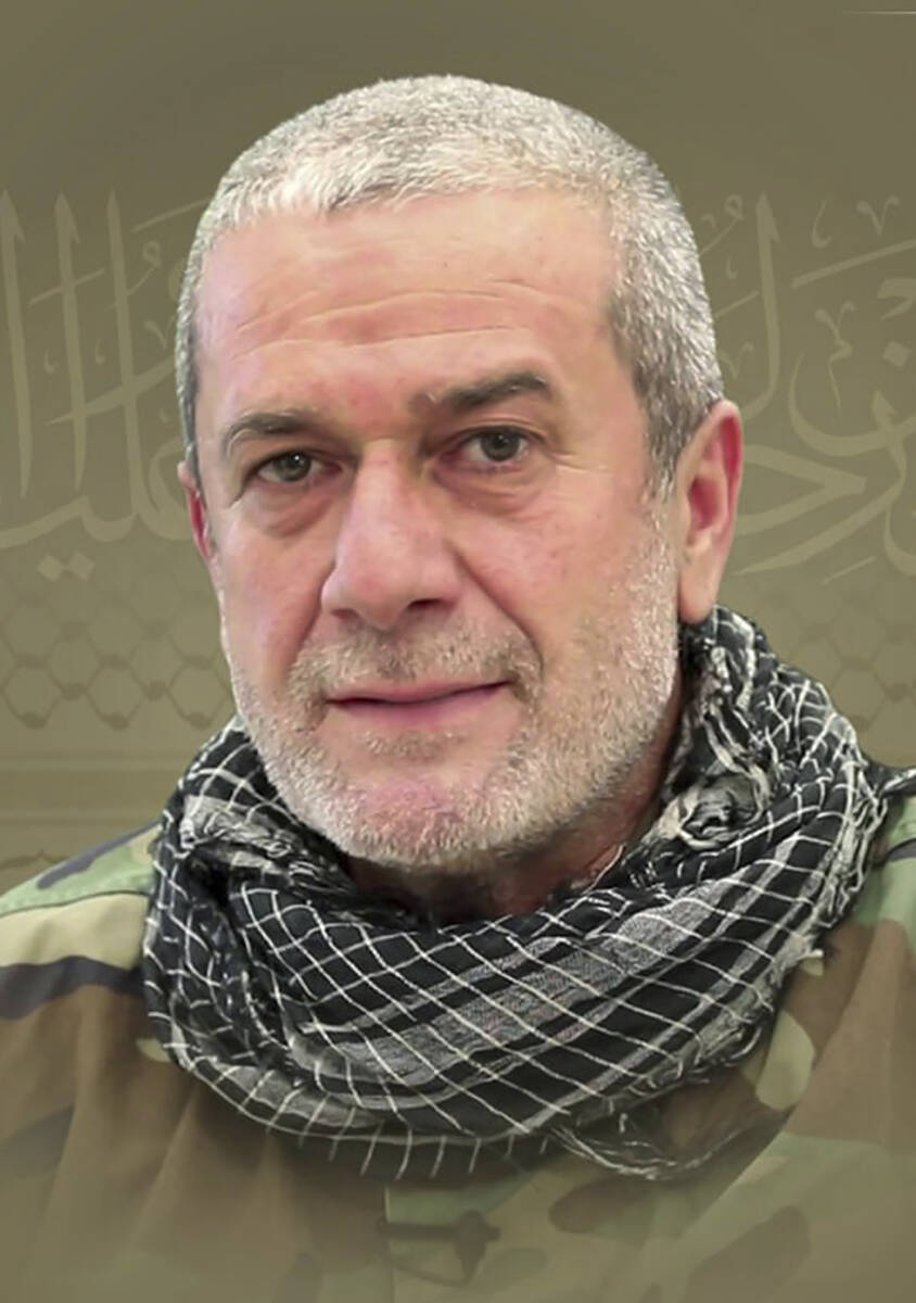 This picture released by Hezbollah media relations office, shows a portrait of Hezbollah comman ...