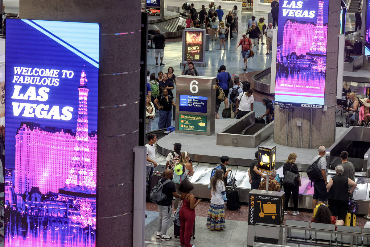 Guests in the baggage claim area of Harry Reid International Airport in Las Vegas, Wednesday, J ...