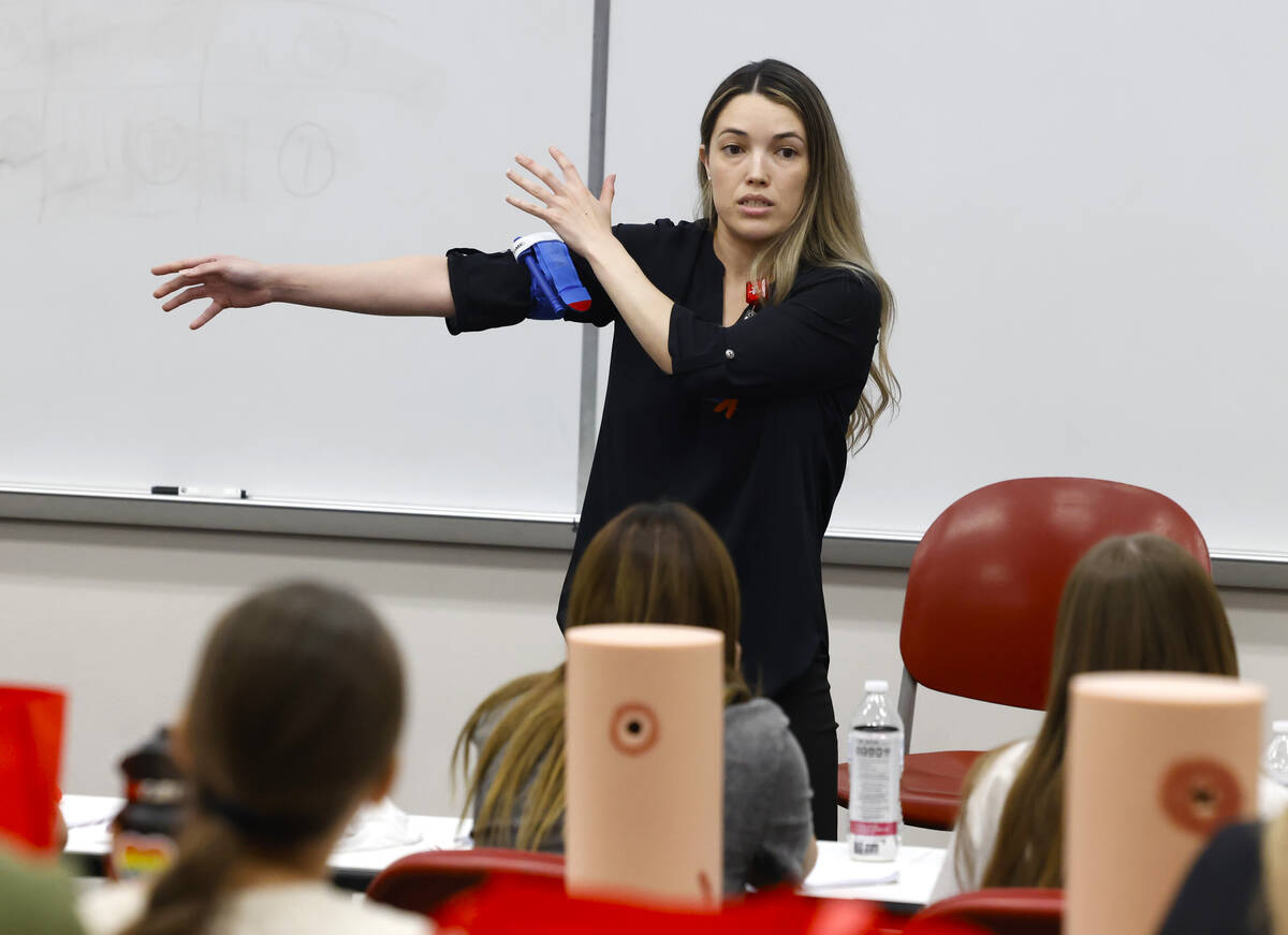 Yvonne James, a registered nurse at UMC, demonstrates how to use tourniquet, a device for stopp ...