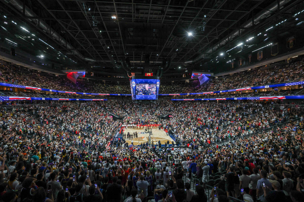 Fans stand to recognize Team USA and Team Canada before a showcase basketball game at T-Mobile ...
