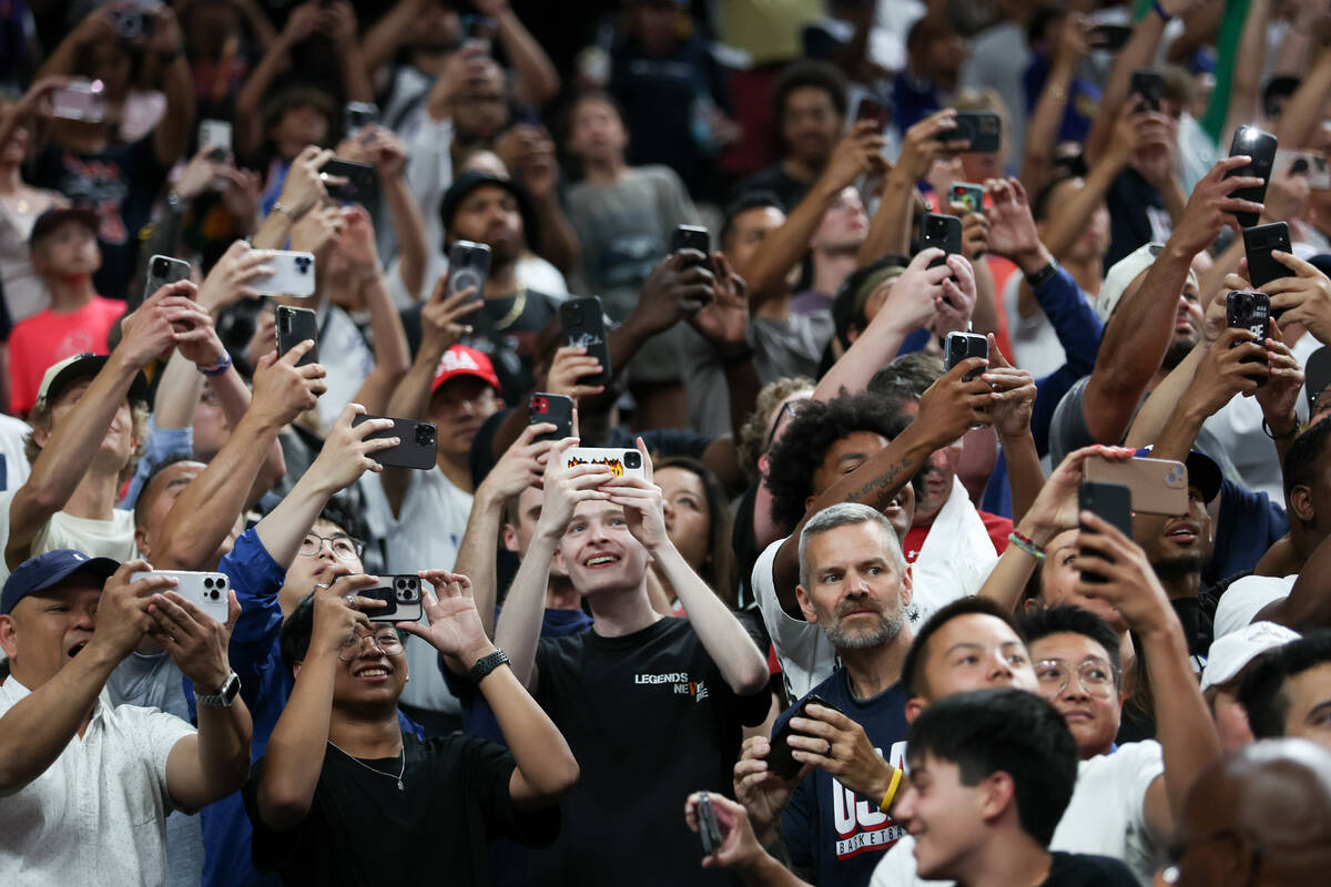 Fans record as Team USA takes the court for a showcase basketball game against Canada at T-Mobi ...