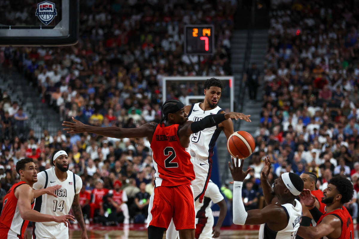 USA guard Tyrese Haliburton (9) finds an opening to pass behind Canada guard Shai Gilgeous-Alex ...