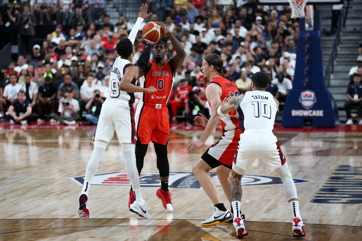 Canada guard Luguentz Dort (0) shoots against USA guard Tyrese Haliburton (9) during the second ...