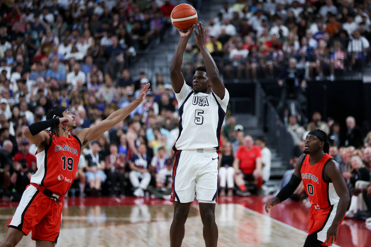 USA guard Anthony Edwards (5) shoots against Canada guard Andrew Nembhard (19) while Canada gua ...