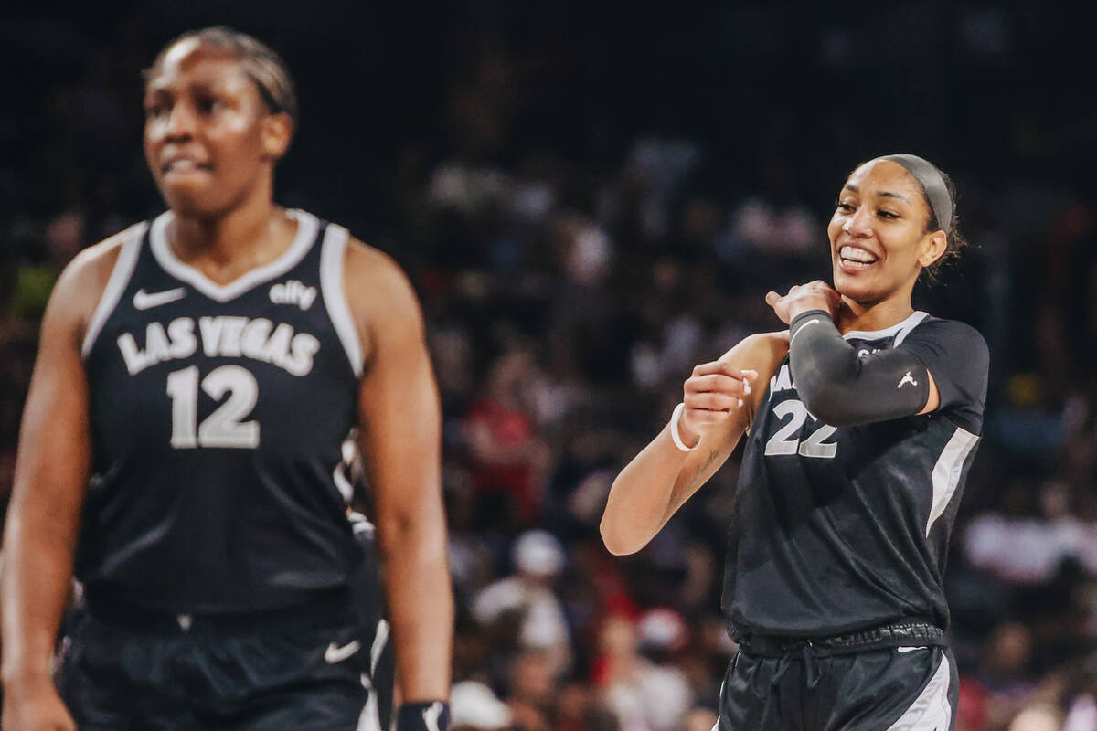 Aces center A'ja Wilson (22) walks back onto the court after being announces as the Aces’ all ...