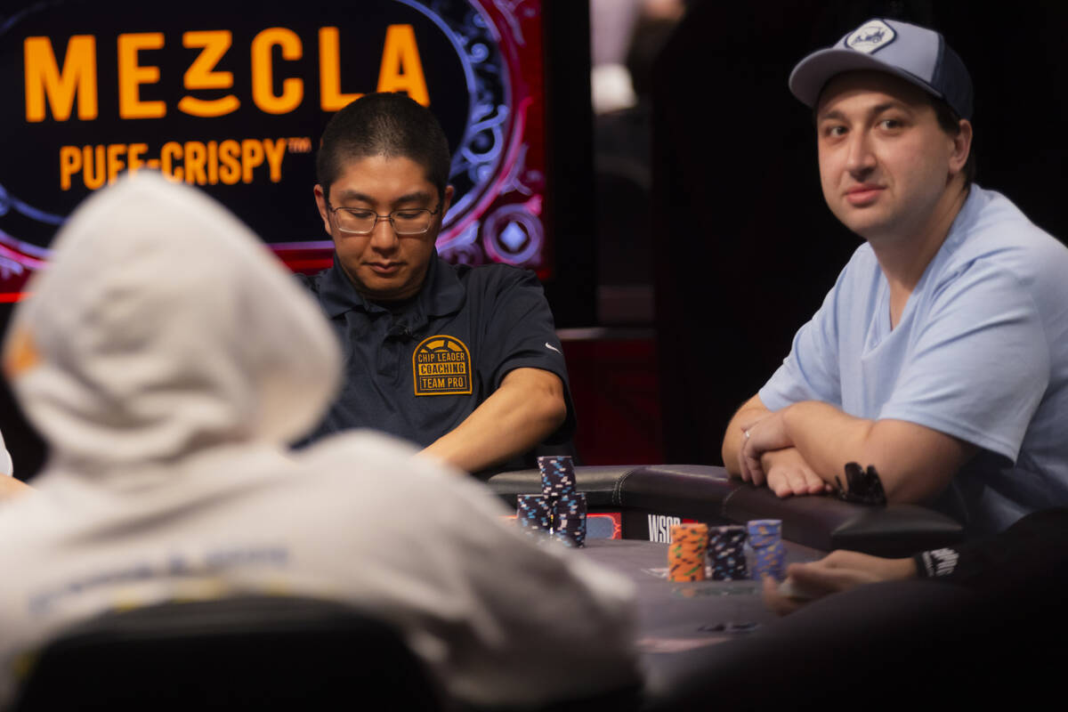 Jordan Griff, right, looks on as Jonathan Tamayo checks his cards as they compete in the final ...