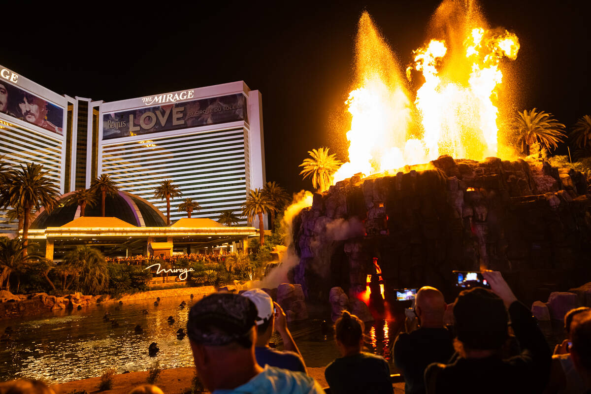 People watch the final scheduled volcano show during the final night of operations and gaming a ...