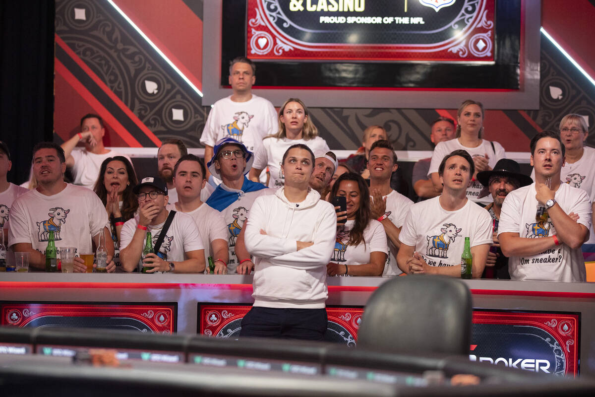 Niklas Astedt, center, watches his hand play with family and friends while competing in the fin ...