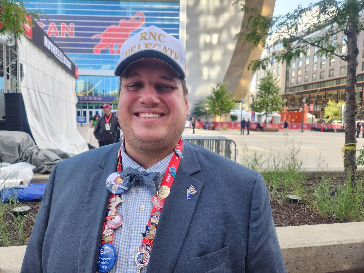 Henderson resident Alan Hedrick, a first-time delegate, poses for a photo outside of Fiserv For ...