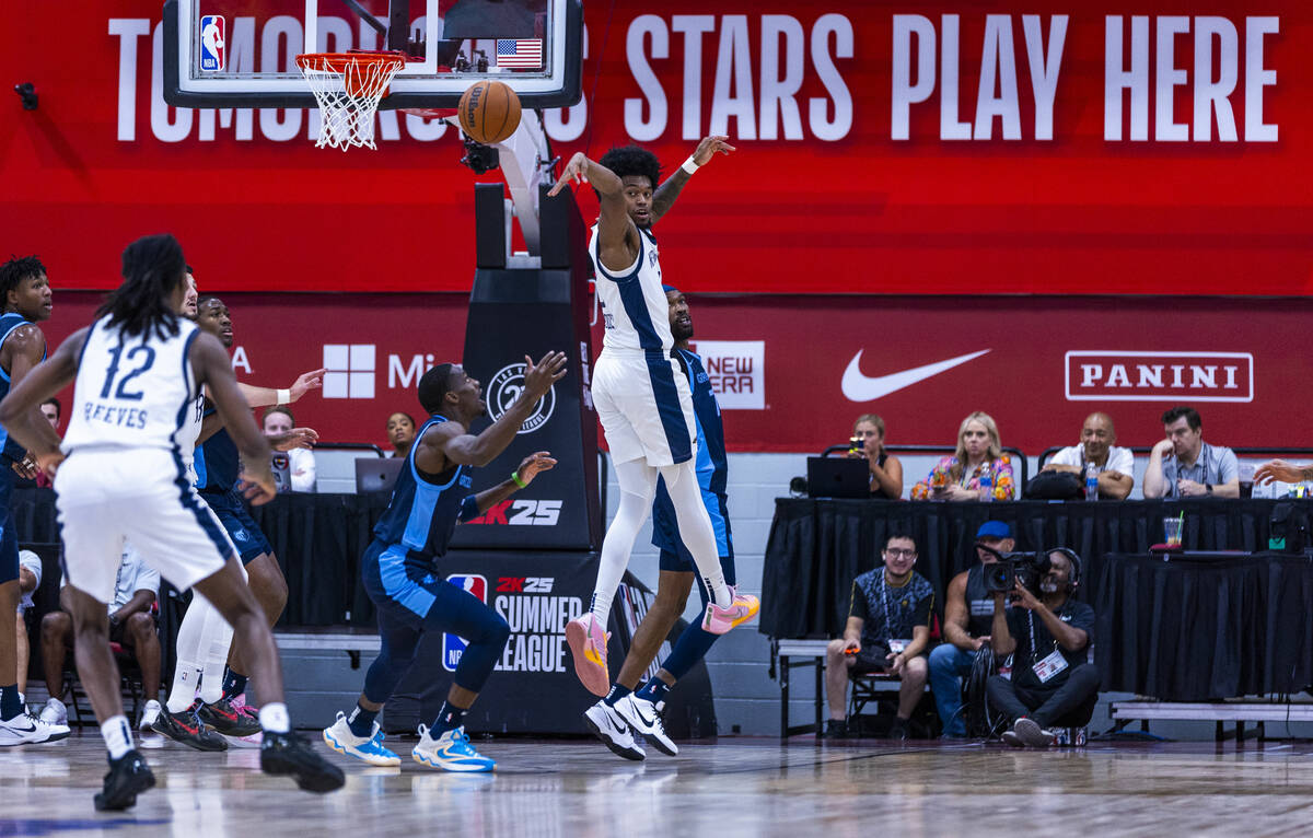 New Orleans Pelicans forward Keion Brooks Jr. (2) passes back over Memphis Grizzlies guard Isai ...