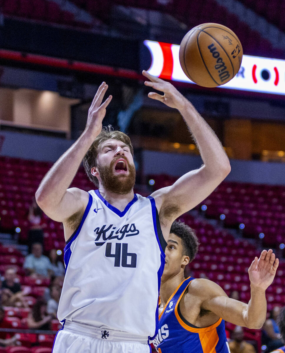 Sacramento Kings center Drew Timme (46) is fouled in the lane by Phoenix Suns forward Oso Ighod ...