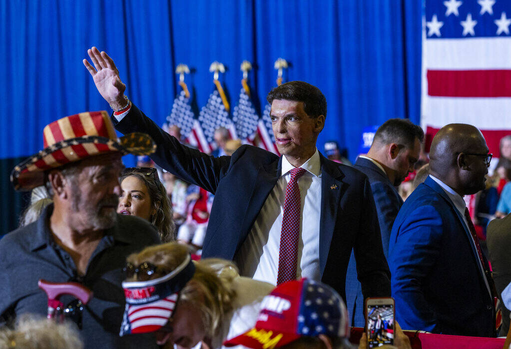 U.S. Senate candidate Sam Brown waves to supporters before a rally at Liberty High School on Tu ...