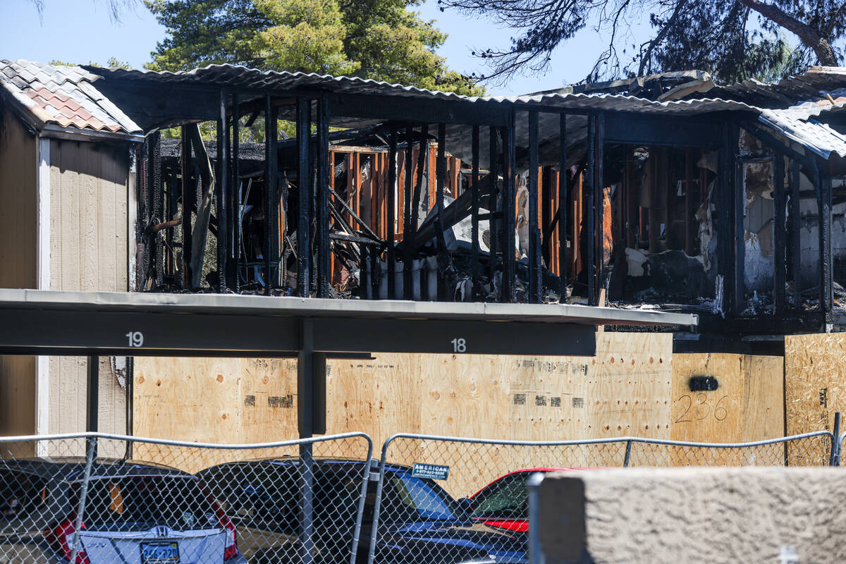 The remnants of the burned apartment complex where one person was killed and four were injured ...