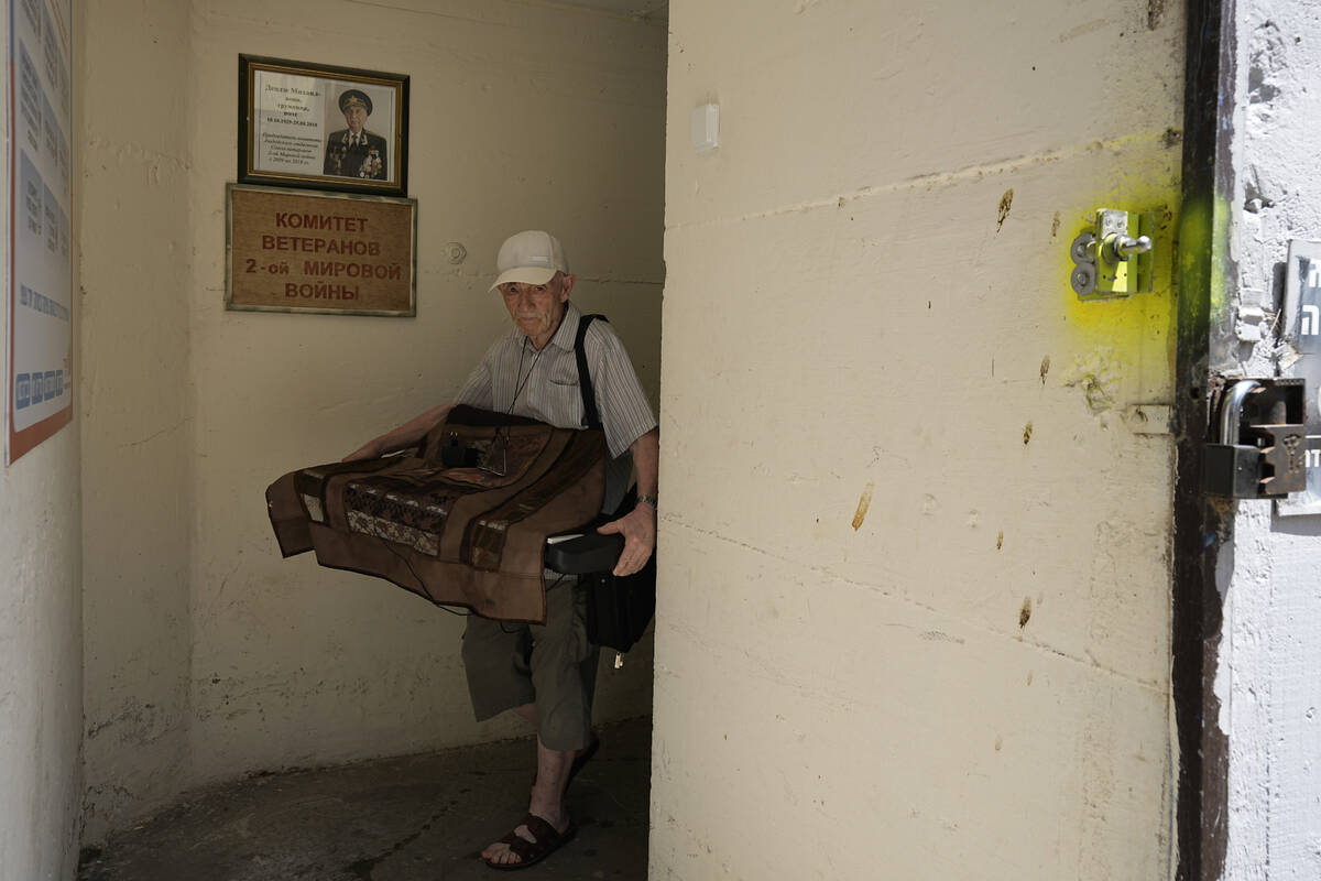 A man readies a bomb shelter in Ashdod, southern Israel, Sunday, Aug. 4, 2024, after the city o ...