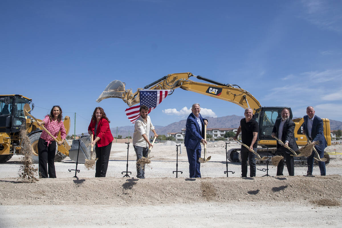 Nevada Gov. Joe Lombardo, center, joined by other officials from the state, Clark County, and t ...