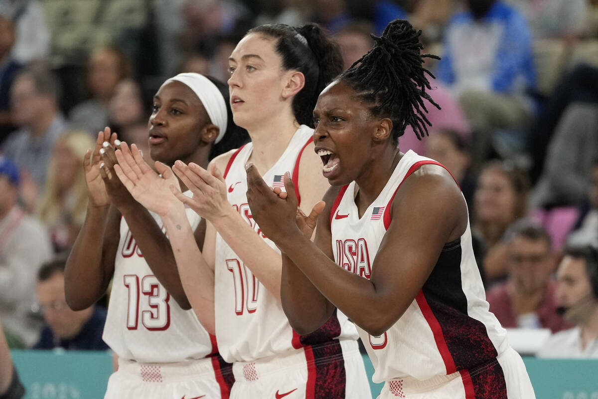 United States' Jackie Young (13), Breanna Stewart (10) and Chelsea Gray (8) celebrate as Austra ...
