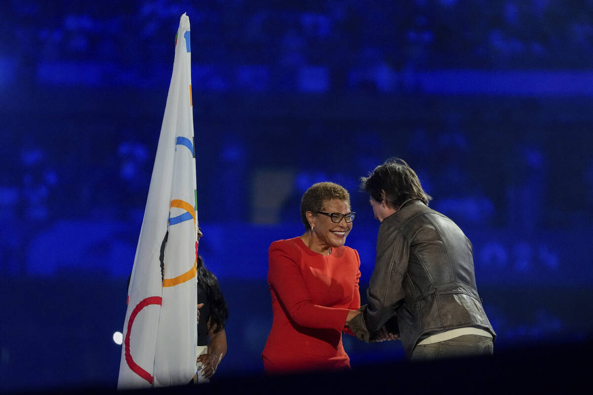 Tom Cruise greets Los Angeles Mayor Karen Bass during the 2024 Summer Olympics closing ceremony ...