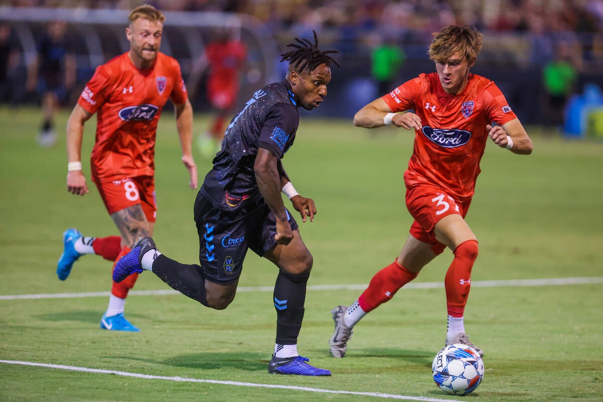 Lights FC midfielder Joseph-Claude Gyau (7) and Indy Eleven defender Logan Neidlinger (37) cha ...
