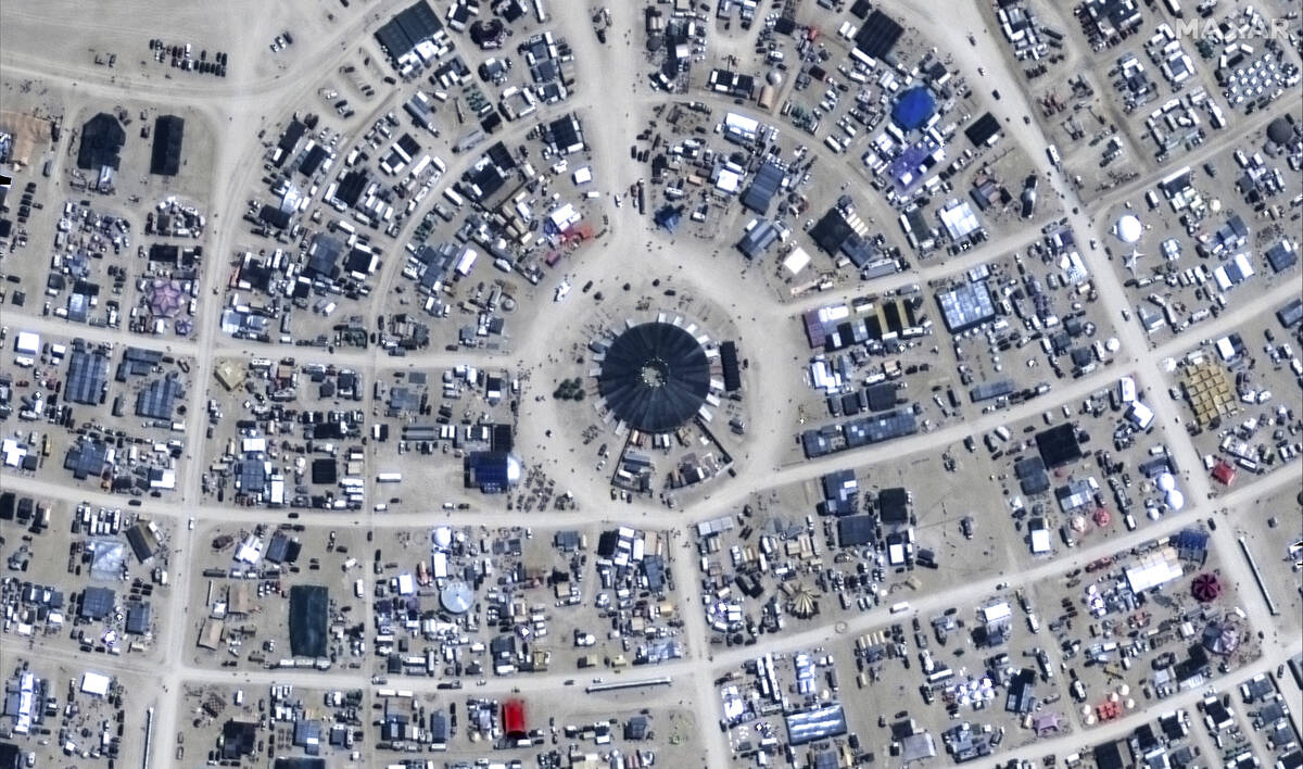 This image released by Maxar Technologies shows an overview of the center camp of the Burning M ...