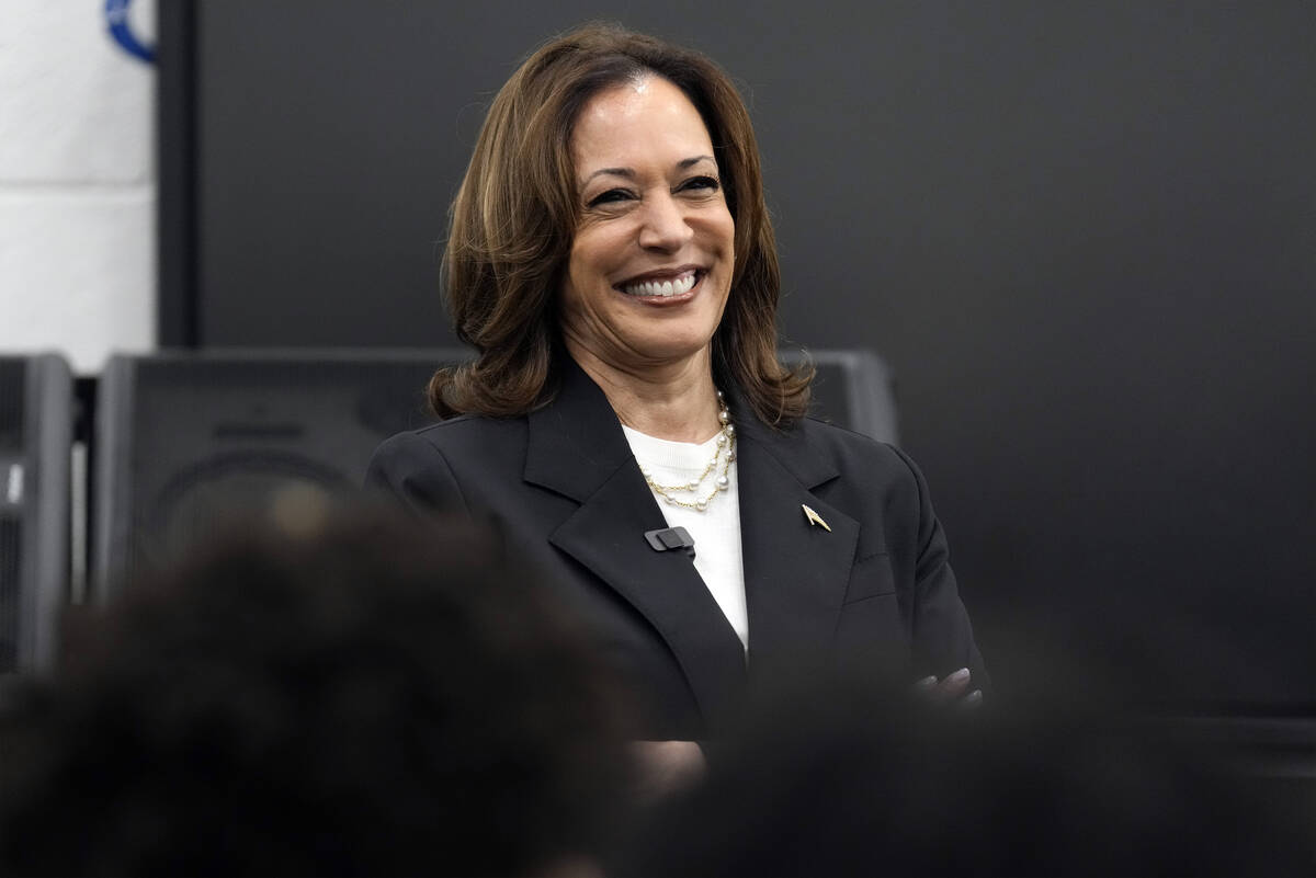 Democratic presidential nominee Vice President Kamala Harris speaks to marching band members at ...