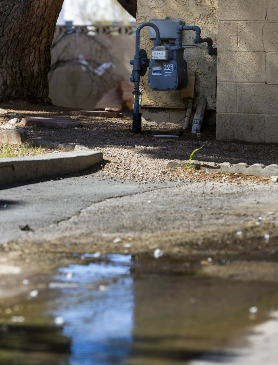 Water continues to flow in one of many carports in the Somerset Park community where seeping is ...