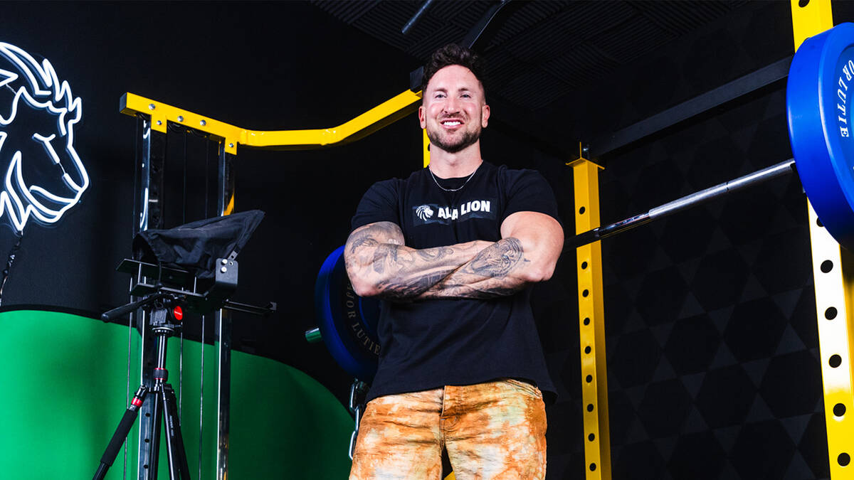 Troy Adashun, a local “fitfluencer,” or fitness influencer, and YouTube star inside his hom ...