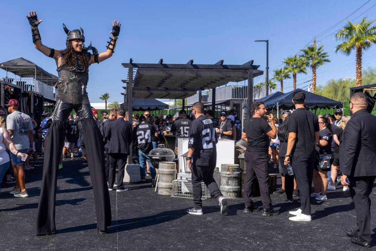 A performer entertains the fans in the new Raiders Pregame Masqueraid venue in the tailgate bef ...