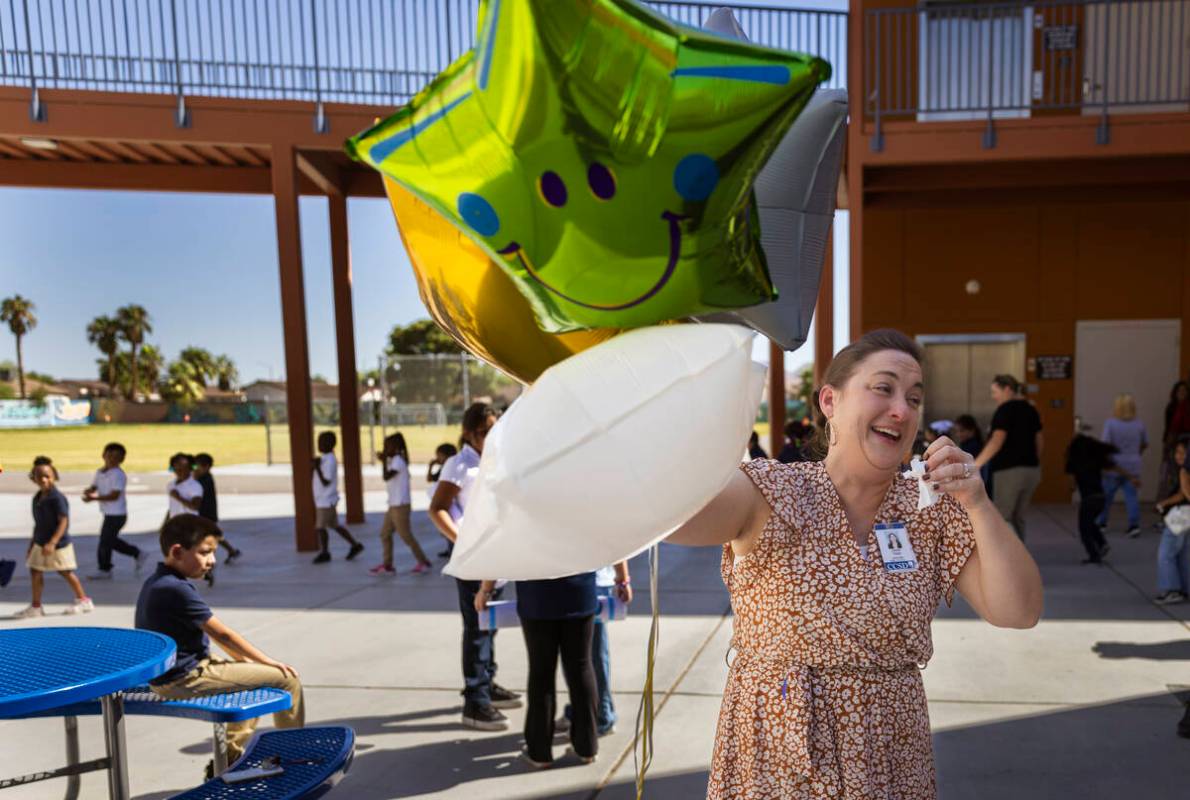 Pre-K teacher Leigh Todd of Tate Elementary School reacts after being named early educator of t ...