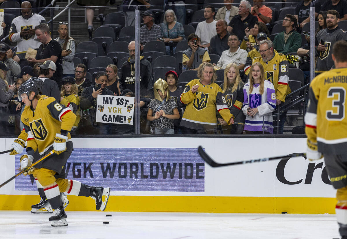 Fans line the glass as the Golden Knights and Los Angeles Kings warm up before the first period ...