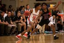 Bishop Gorman's Zaon Collins (10) dribbles past Durango's Keshon Gilbert (10) at Desert Oasis H ...