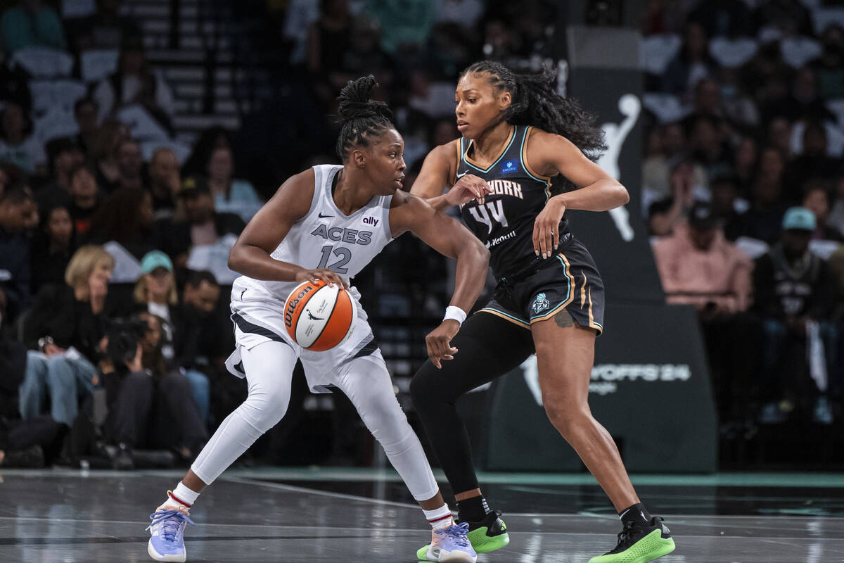 Aces forward A'ja Wilson is defended by New York Liberty forward Betnijah Laney-Hamilton (44) d ...