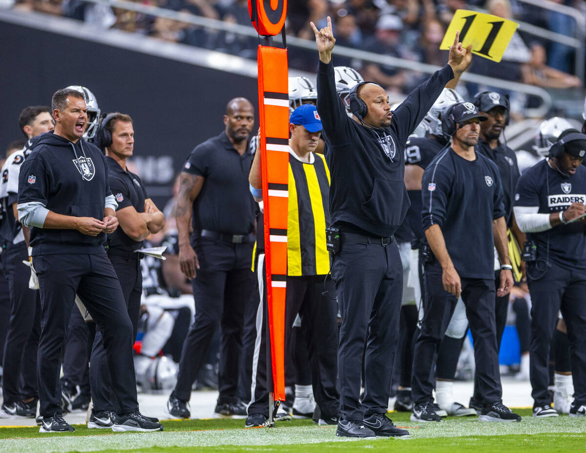 Raiders Head Coach Antonio Pierce signals players on the field against the Cleveland Browns dur ...