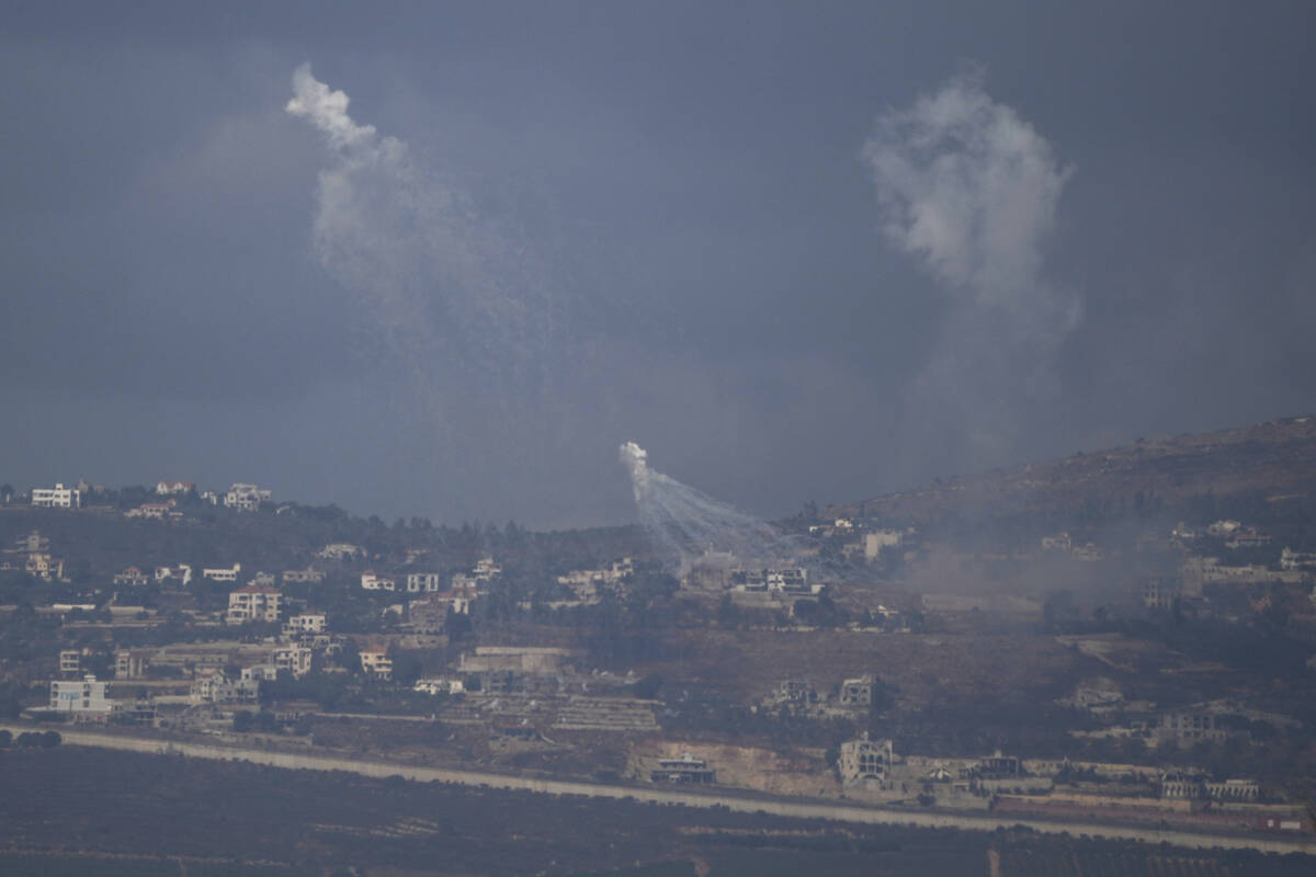 Israeli shelling hits an area in southern Lebanon as seen from northern Israel, Tuesday, Oct. 1 ...
