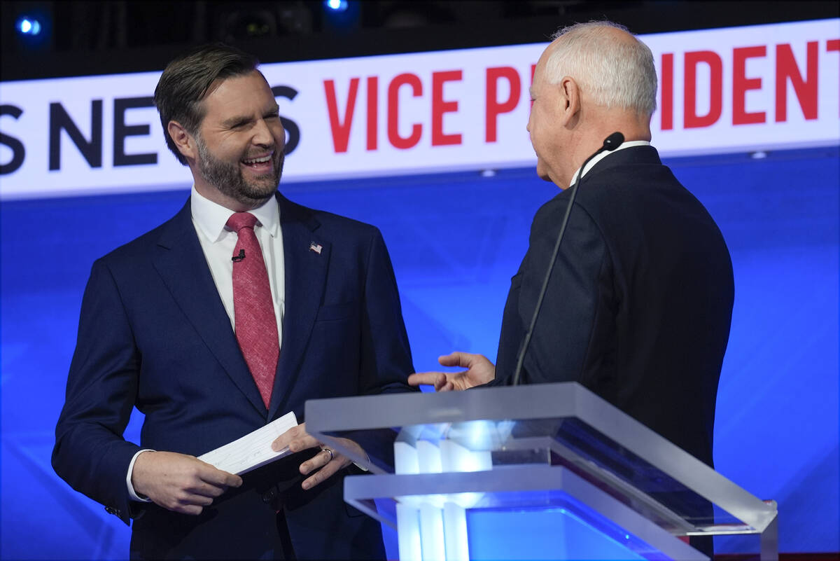 Republican vice presidential nominee Sen. JD Vance, R-Ohio, talks with Democratic vice presiden ...