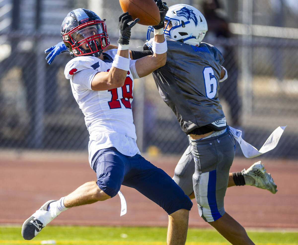 Coronado wide receiver Landon Sanford (19) secures a touchdown pas under tight coverage by Basi ...