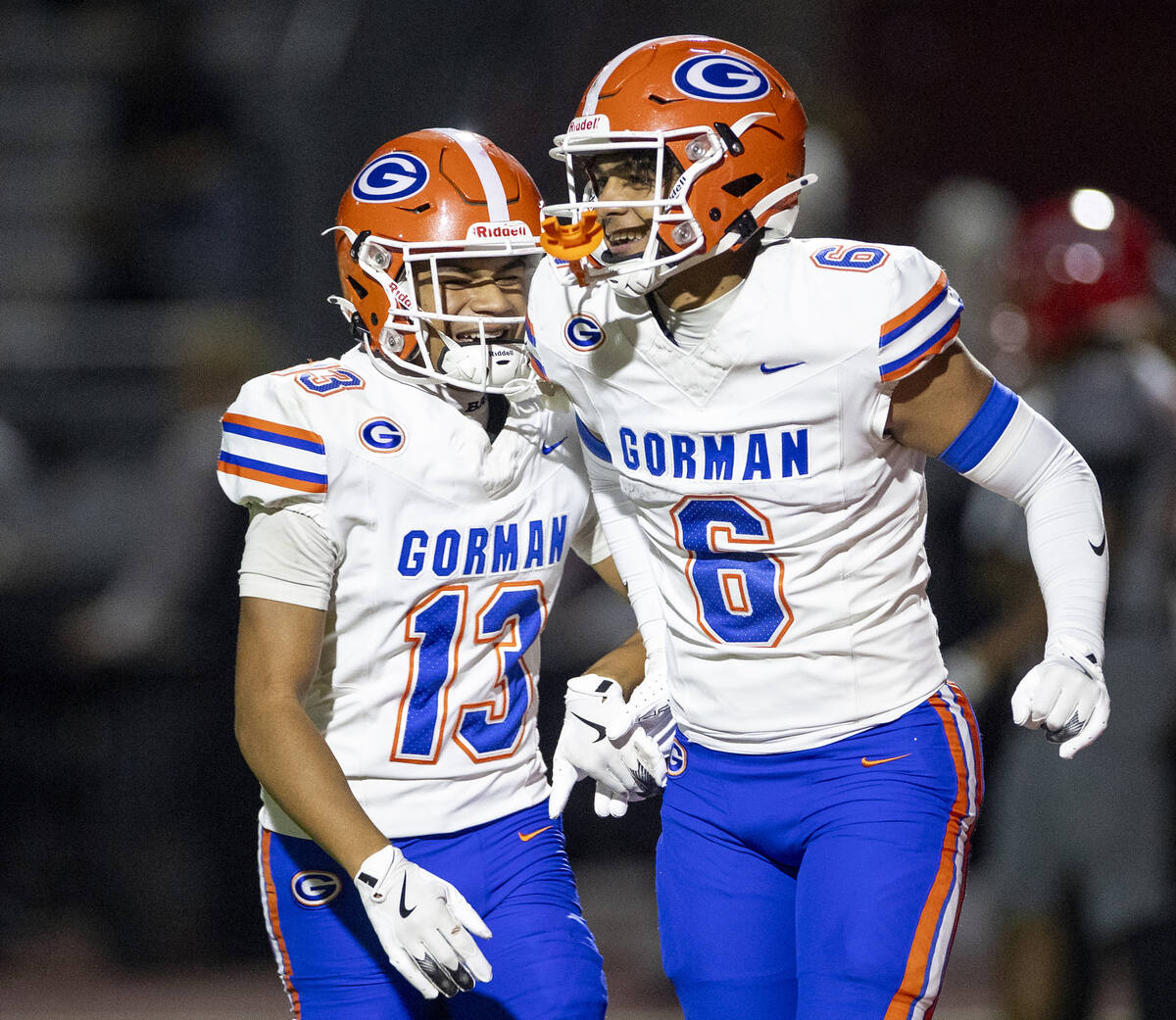 Bishop Gorman wide receiver Aizen Torres (13) and wide receiver Brandon Gaea (6) celebrate a pl ...