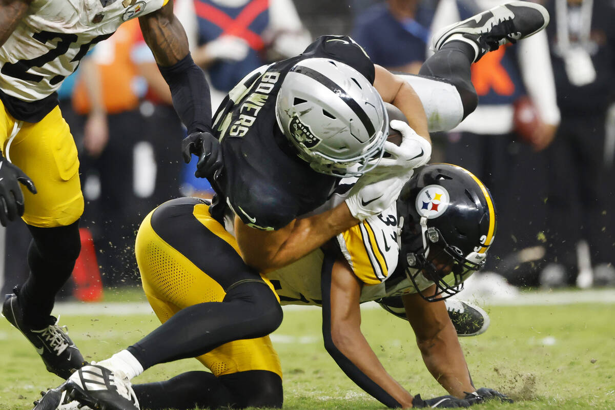 Raiders tight end Brock Bowers (89) is tackled by Pittsburgh Steelers safety Minkah Fitzpatrick ...