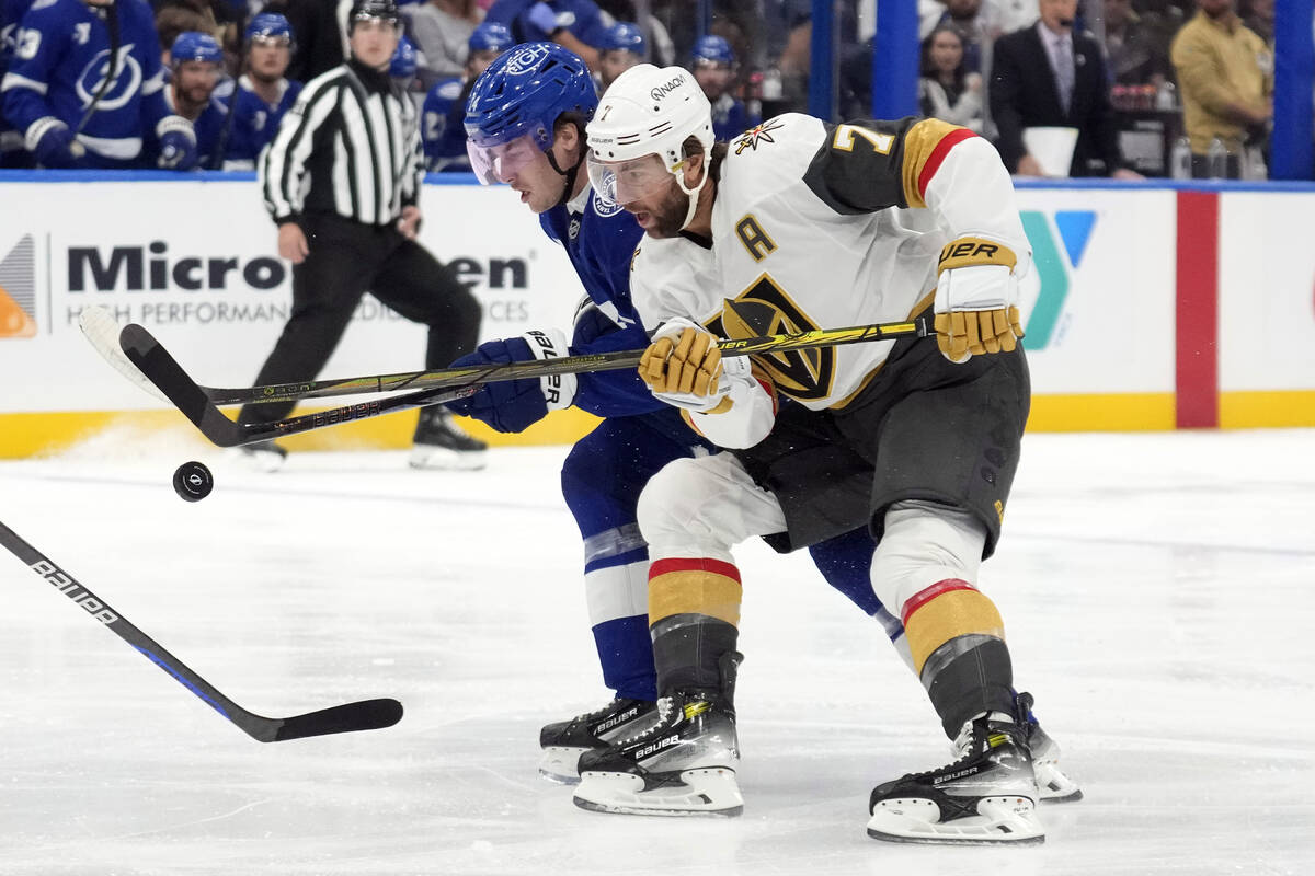 Vegas Golden Knights defenseman Alex Pietrangelo (7) and Tampa Bay Lightning center Conor Geeki ...