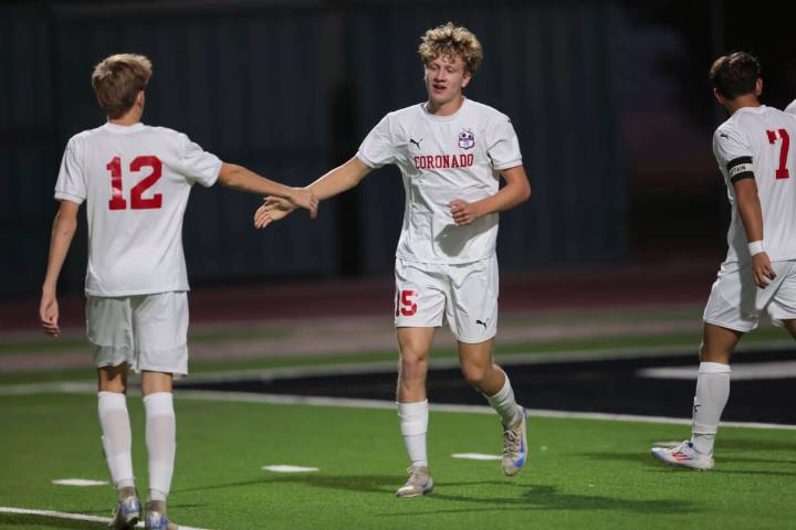 Coronado's Ben Aronow (15) celebrates his goal with Liam Bringhurst (12) during a soccer game a ...