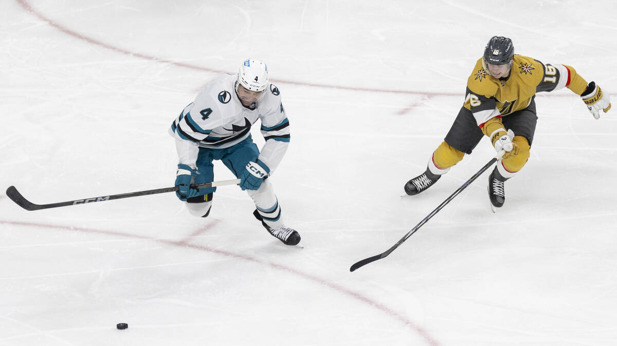 San Jose Sharks defenseman Cody Ceci (4) and Golden Knights left wing Pavel Dorofeyev (16) skat ...