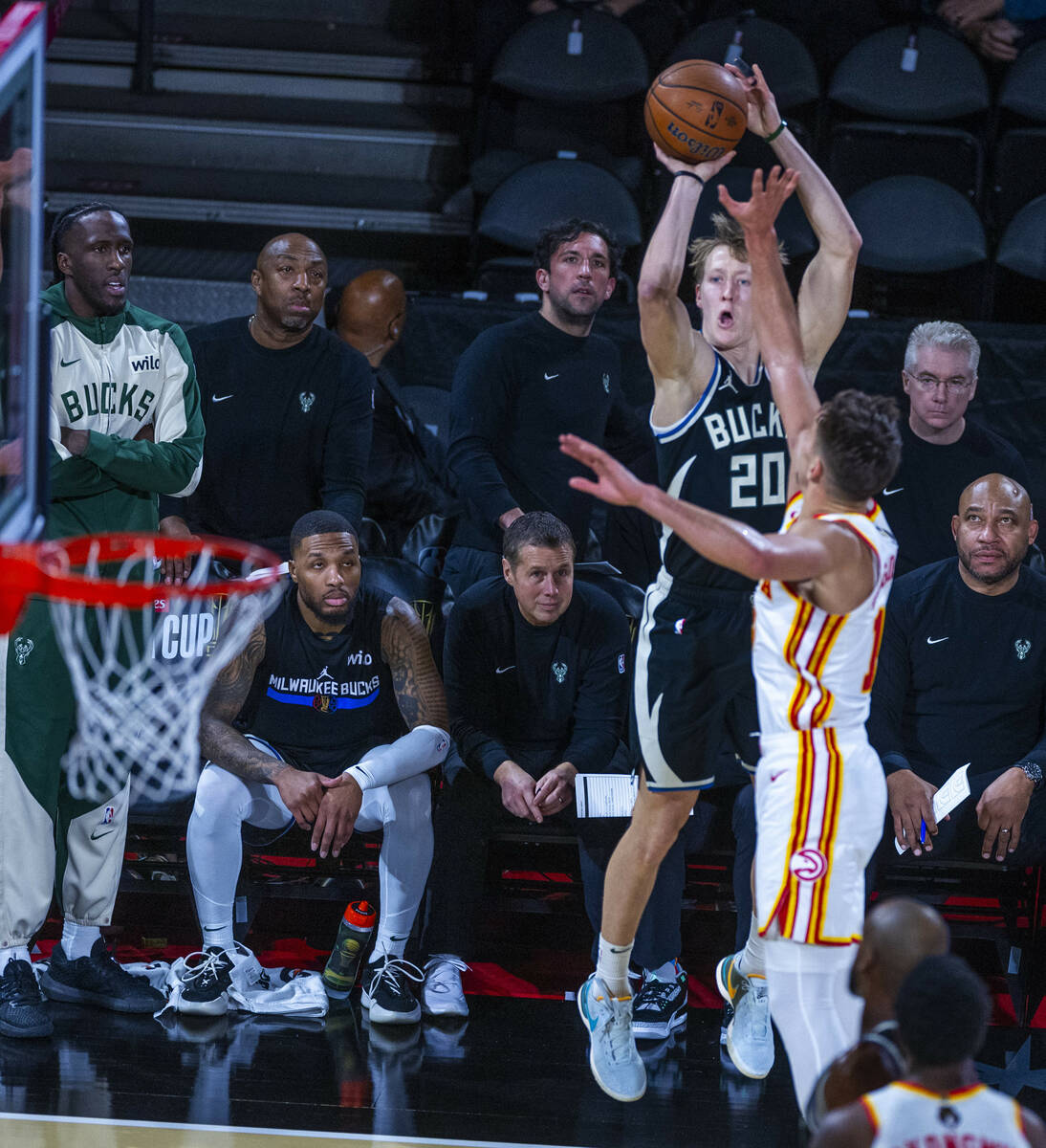 Milwaukee Bucks guard AJ Green (20) posts up for a three-point basket over Atlanta Hawks guard ...