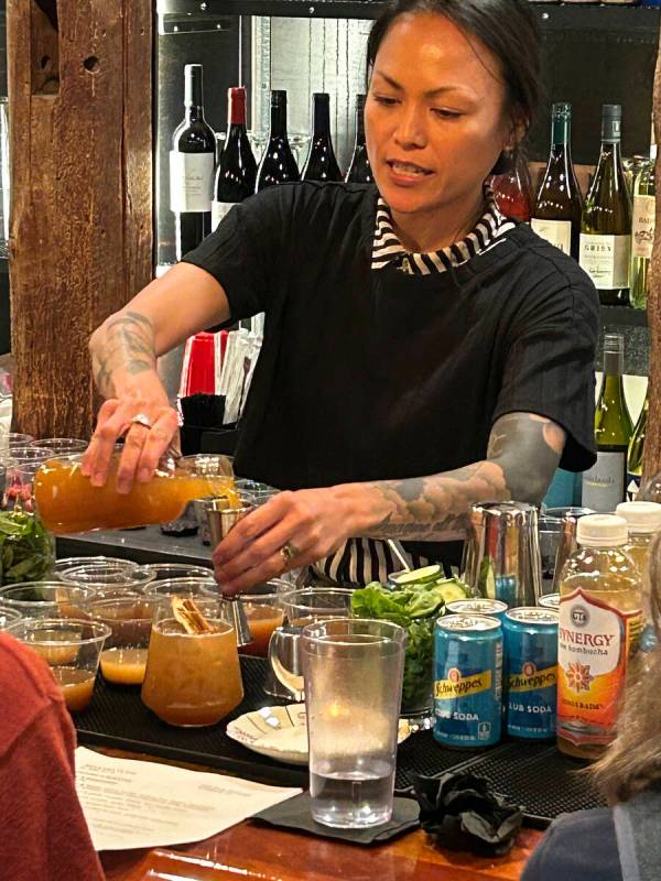 Bartender Patty Burns makes a drink called the Fall Apple Spritz, made with a spiced simple syr ...