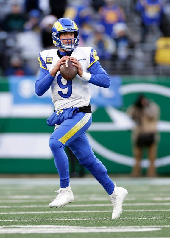 Los Angeles Rams quarterback Matthew Stafford (9) looks to pass the ball during an NFL football ...