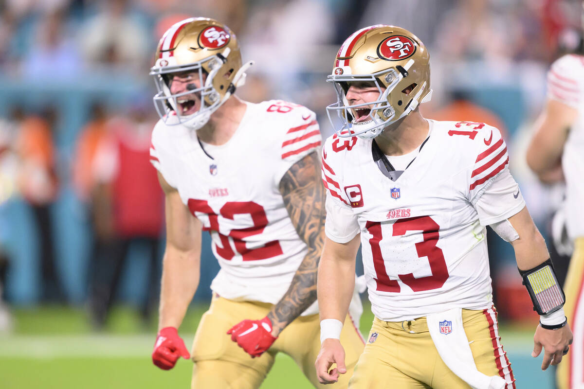 San Francisco 49ers tight end Eric Saubert (82) celebrates scoring a touchdown with quarterback ...