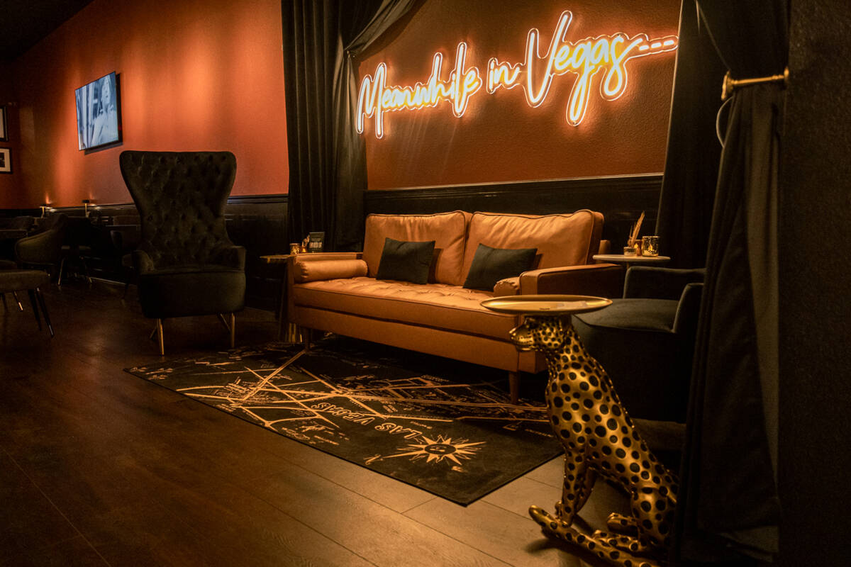 Presley the leopard, foreground, in the tasting room at Las Vegas Distillery in Henderson. (Las ...