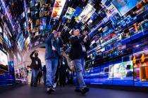 Attendees walk through an installation highlighting LG Electronics' webOS smart TV platform dur ...