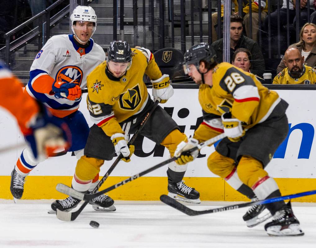Golden Knights right wing Cole Schwindt (22) controls the puck over New York Islanders left win ...